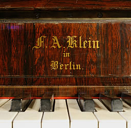 Klein Lyre piano  manufacturers logo on fall