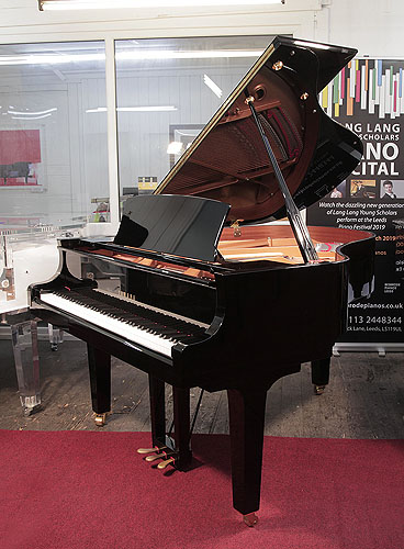 Yamaha C2 grand piano for sale with a black case and polyester finish.