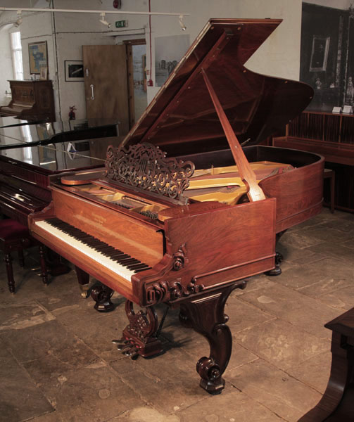 Restored, 1877, Steinway & Sons Style 1 grand piano for sale with a rosewood case and reverse scroll legs. Piano has an eighty-five note keyboard and a three-pedal lyre 