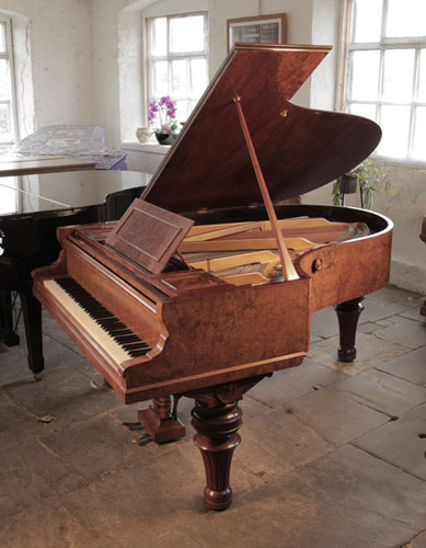 An 1893, Ronisch grand piano for sale with a burr walnut case and turned, fluted legs. Piano formerly the property of Steve Harley from the band Cockney Rebel. 