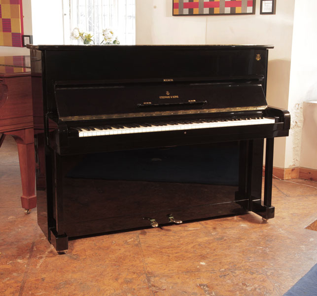 Reconditioned, 1960, Steinway Model Z  upright piano for sale with a black case and brass fittings. Piano has an eighty-eight note keyboard and two pedals