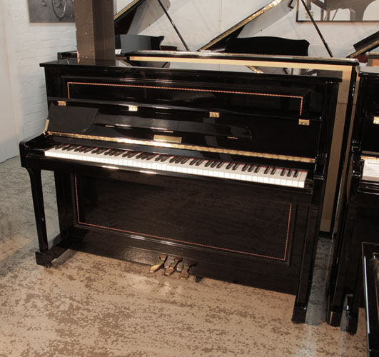 Reconditioned 2016, Pinkham upright piano for sale in black gloss with crossbanded stringing accents. Fall features a slow fall mechanism.. Piano has an eighty-eight note keyboard and and three pedals 
