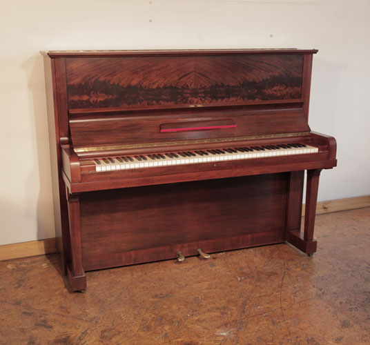 Reconditioned 1937, Steinway model V upright piano with a mahogany case and brass fittings. Piano has an eighty-eight note keyboard and two pedals. 