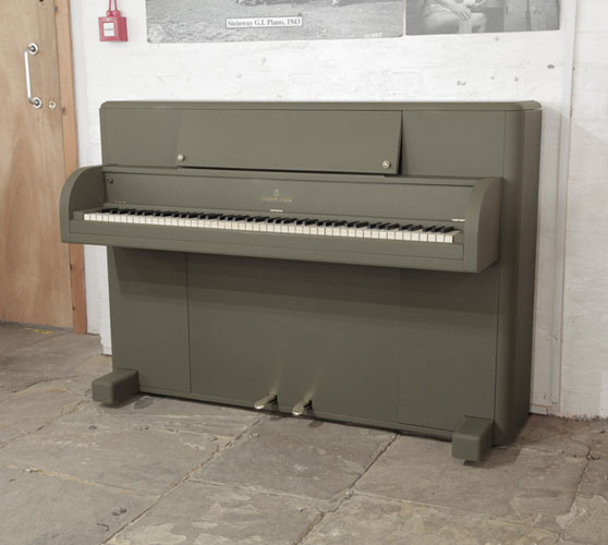 A 1944, Steinway Victory Vertical upright piano with an olive drab case.  These uprights were airdropped onto battlefields via parachutes during WWII for the entertainment of G.I. American troops. 
