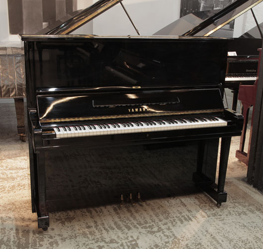 Reconditioned, 1957, Yamaha U3 upright piano for sale with a black gloss case and brass fittings. 