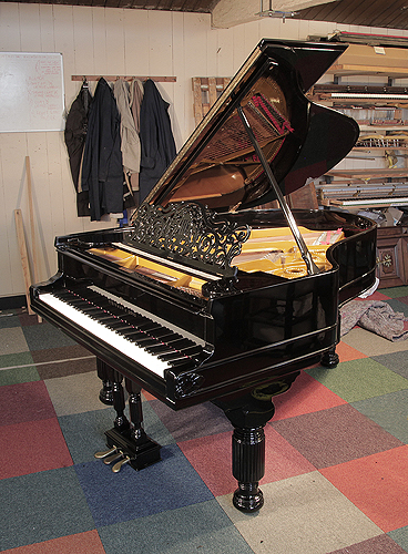 An 1880, Steinway Model A grand piano for sale with a black case, filigree music desk and fluted, barrel legs