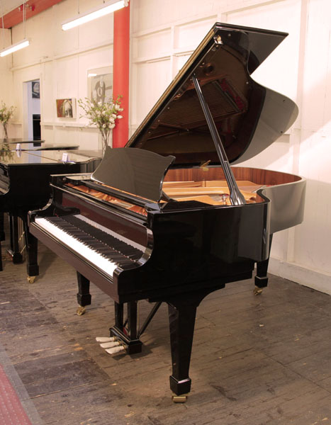 Brand new, Toyama TC-187 grand piano for sale with a black case and spade legs