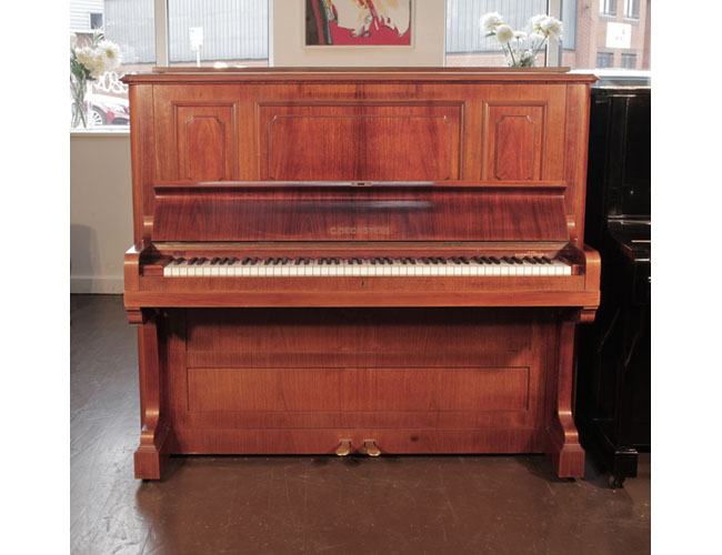 Reconditioned,  1924, Bechstein model 8 upright piano with a rosewood case and brass fittings. Piano has an eighty-eight note keyboard and two pedals. 