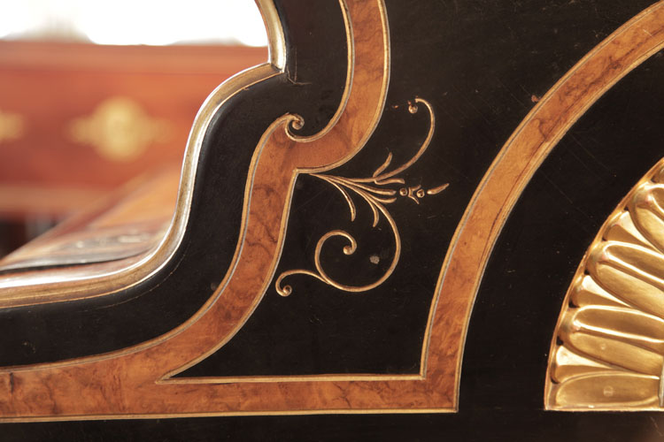 Gold stylised flowers and tendrils carved on piano cheek