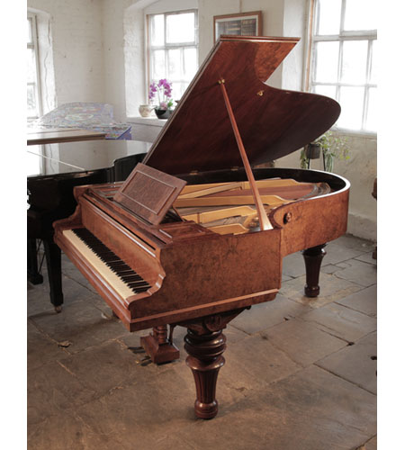 An 1893, Ronisch grand piano for sale with a burr walnut case and turned, fluted legs. Piano formerly the property of Steve Harley from the band Cockney Rebel.  
