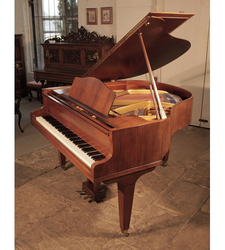 Reconditioned, 1970, Welmar baby grand piano for sale with a mahogany case and square, tapered legs. Piano has an eighty-eight note keyboard and a two-pedal lyre. 