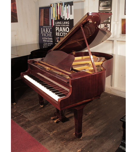 Reconditioned, 1972, Yamaha G2 grand piano with a mahogany case and spade legs. Piano has an eighty-eight note keyboard and a two-pedal lyre. 