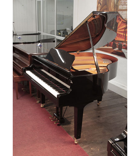 A 2001, Yamaha GA1 baby grand piano for sale with a black case and square, tapered legs. Piano has an eighty-eight note keyboard and a three-pedal lyre.