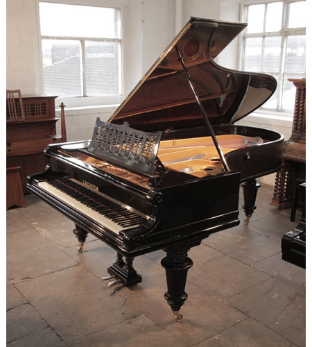 An 1897, Bechstein Model D grand piano for sale with a polished, black case and turned, faceted legs.. Piano has an eighty-eight note keyboard and a two-pedal lyre. 