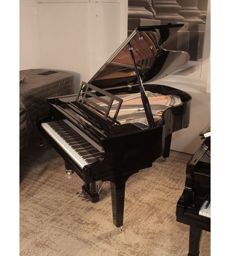 Brand new, Feurich Model 179 Dynamic II grand piano in black gloss with chrome fittings. Frame is sprayed with a gun metal finish. Piano has an eighty-eight note keyboard and a three-pedal piano lyre. 