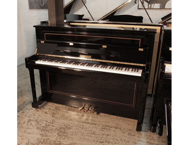 Reconditioned 2016, Pinkham upright piano for sale in black gloss with crossbanded stringing accents. Fall features a slow fall mechanism.