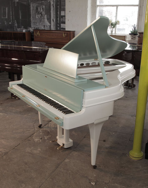 Rippen grand piano with a contrasting satin teal and painted aluminium case