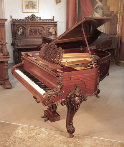 Rococo Style, 1900, Schiedmayer grand piano for sale with a mahogany case and carved cabriole legs. Entire cabinet features ornate carvings of scrolling acanthus, foliage and scrolls in high relief. . Piano has an eighty-five note keyboard and a two-pedal lyre.