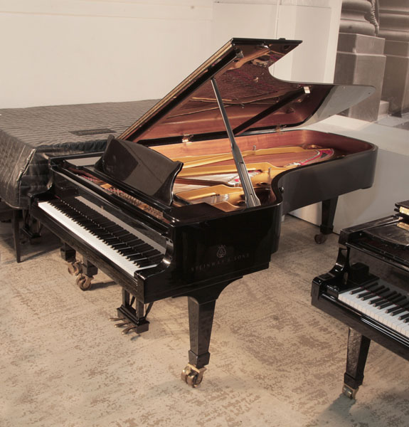 A 1995, Steinway & Sons Model D concert grand piano with a black gloss case.  