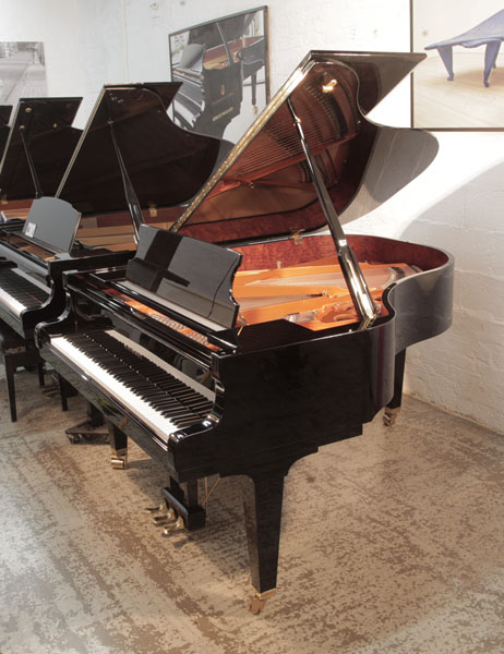 As new 2016, Schimmel C189  grand piano for sale with a black gloss case. Piano has an eighty-eight note keyboard and a three-pedal lyre.