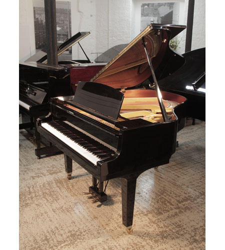 Reconditioned, 1992, Yamaha GH1 baby grand piano for sale with a black case and square, tapered legs..  Piano has an eighty-eight note keyboard and a three-pedal lyre